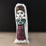 Mini illustrated Frida Kahlo doll.