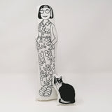 Black and white fabric doll of Philippa Perry and Kevin the cat.