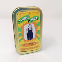 Small tin packaging of a Tinned Idol mini doll of Keith Brymer Jones