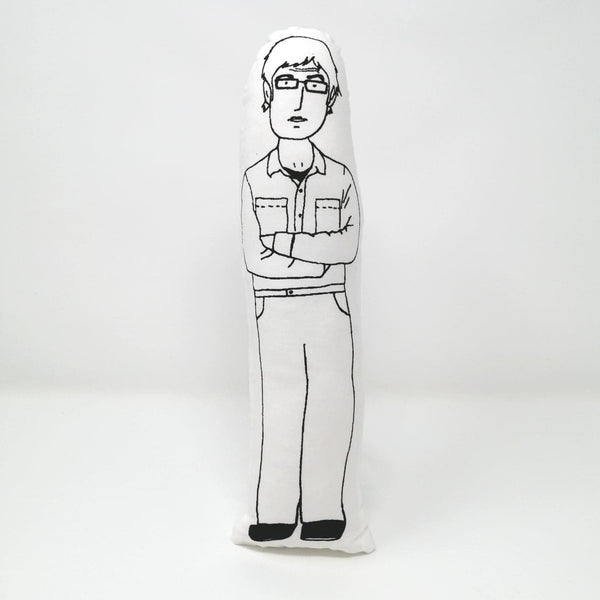 Black and white fabric doll of Louis Theroux.