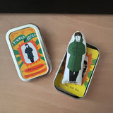 Mini illustrated fabric doll gift featuring Oasis frontman, Liam Gallagher, and a keepsake tin.