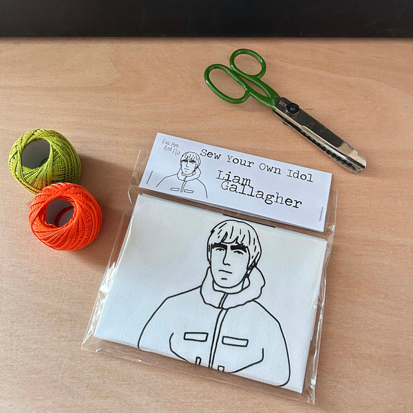 Sew Your Own Liam Gallagher idol craft kit on a table with craft supplies.