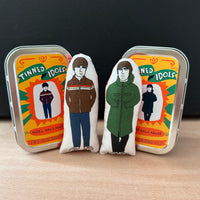 Mini illustrated fabric doll gift featuring Oasis brothers, Noel and Liam Gallagher, with keepsake tins.