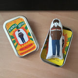 Mini illustrated fabric doll gift featuring Oasis lead guitarist, Noel  Gallagher, with a keepsake tin.