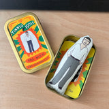 Mini fabric collectible doll and keepsake tin featuring an illustration of Irish actor Paul Mescal. On a wooden surface.