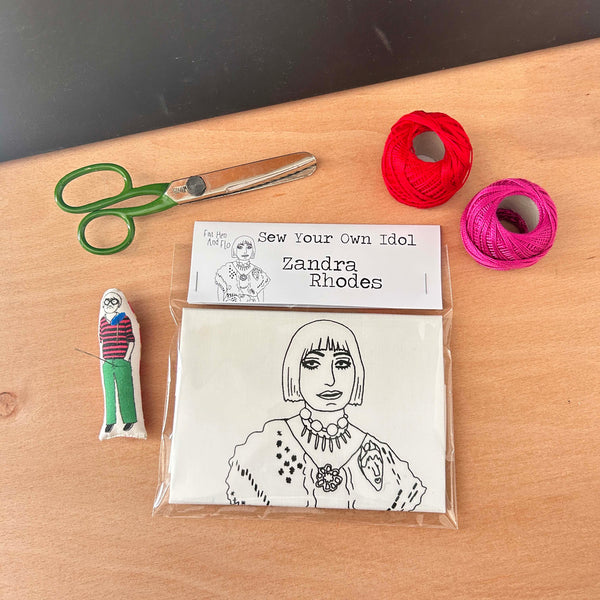 A craft kit to Sew Your Own Idol which contains a black and white fabric cushion featuring an illustration of Zandra Rhodes.