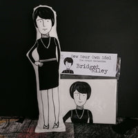Black and white fabric doll and craft sewing kit of British artist Bridget Riley.