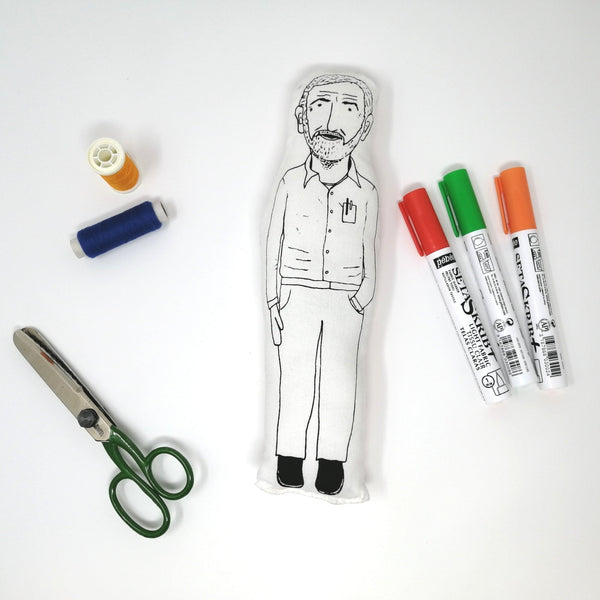 Jeremy Corbyn fabric doll amongst craft supplies on a white background