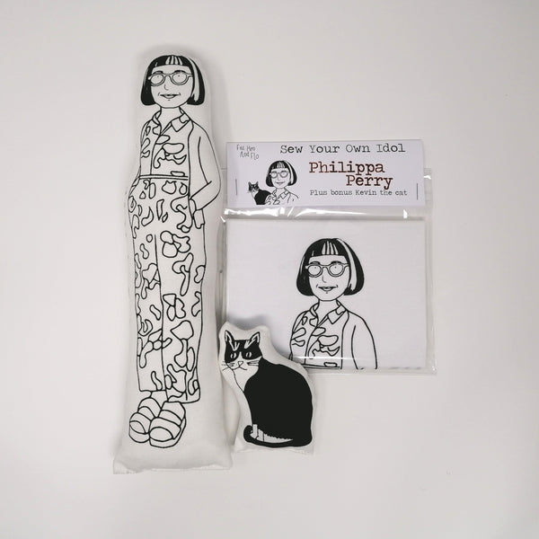Philippa Perry fabric doll alongside a Sewing craft kit and a cat fabric doll on a white background.