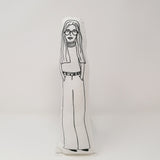 Black and white screen printed fabric doll of feminist Gloria Steinem against a white background.