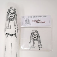 Black and white screen printed fabric doll and craft kit featuring Gloria Steinem