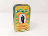 Tin for a Tinned Idol mini fabric doll of Keanu Reeves on a white background