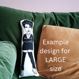 A cushion featuring the singer Robert Smith on a green sofa. Image overlay of the words 'Example design for LARGE size'.