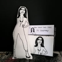 Black and white fabric doll of PJ Harvey and a Sew Your Own PJ Harvey doll craft kit. 