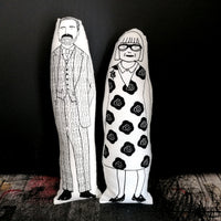 Black and white screen printed fabric dolls featuring an illustration of The Great British Sewing Bee hosts Patrick Grant and another of Esme Young.