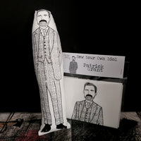 A black and white screen printed fabric doll and craft kit featuring an illustration of The Great British Sewing Bee host Patrick Grant.