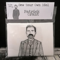 A black and white screen printed sewing craft kit featuring an illustration of The Great British Sewing Bee host Patrick Grant.