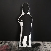 Reverse of a fabric screen printed doll featuring a silhouette design of Vivienne Westwood.