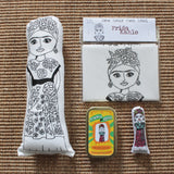 Selection of Frida Kahlo gifts. Fabric doll, sewing craft kit and mini doll in a tin