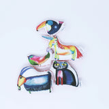 A selection of illustrated animal soft fabric toys. A puffin, unicorn, bird, cat and goat on a white background.