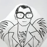 Close up of a screen printed fabric doll of Elton John