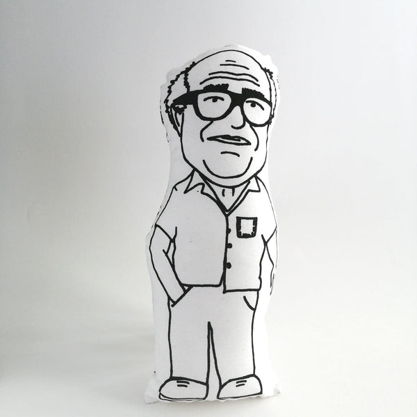 Fabric doll of Danny Devito on a white background