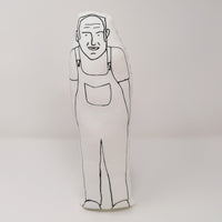 Black and white screen printed fabric doll of Keith Brymer Jones from The Great Pottery Throw Down on a white background