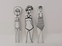 Three screen printed fabric swimmer dolls made from a craft kit. 